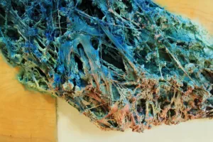 Cloud Function — painted relief; built up in heavy, tactile impasto; in spray paint; blue and pink tones — detail, close-up of surface texture