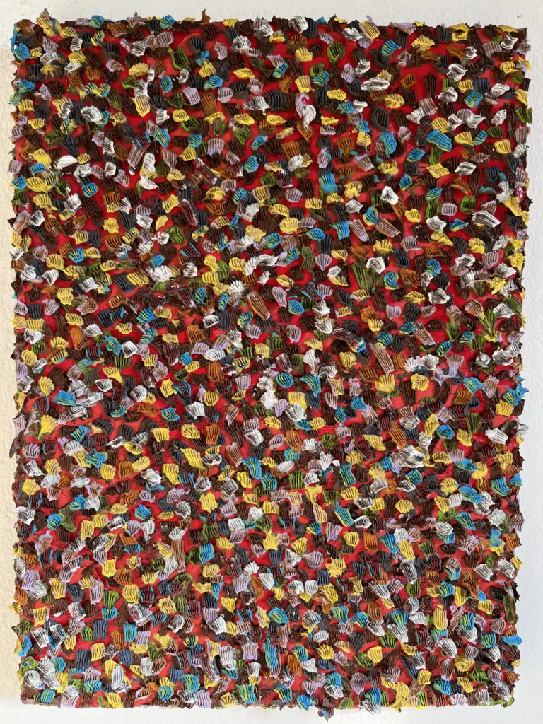 Gum Wall Tactile Textured Squeeze — abstract oil-and-wax painting; hundreds of piped impasto dabs in yellow, blue, white, green and brown covering a red ground