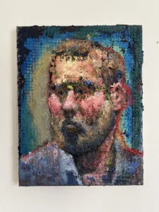 Physical Pixel Portrait Of Bearded Man With Red Cheeks — painting; structured on a grid; in oil on canvas — detail 3 of 3, close-up of surface texture