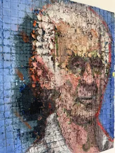 Physical Pixel Portrait Of Man With White Hair — painting; structured on a grid; in oil on canvas; red and blue tones — detail 1 of 5, close-up of surface texture