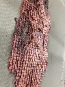 Physical Pixel Tactile Nude Female Figure — painting; structured on a grid; in oil on canvas; pink, brown and gray tones — detail 1 of 2, close-up of surface texture