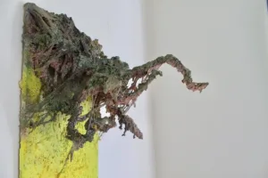 Quick Shoot — painted relief; of an animal; built up in heavy, tactile impasto; in spray paint; yellow, green and brown tones — detail 2 of 4, close-up of surface texture