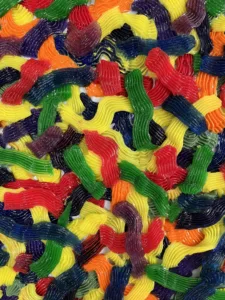 Tactile Candy Relief Squeeze 1 — abstract acrylic-and-gel relief; interlocking piped ribbons of red, yellow, green, blue, purple and orange covering the canvas edge to edge — detail 4 of 9, close-up of surface texture