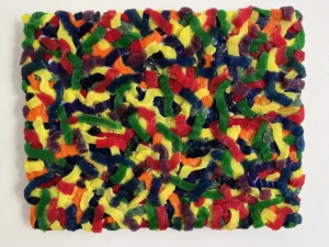 Tactile Candy Relief Squeeze 1 — abstract acrylic-and-gel relief; interlocking piped ribbons of red, yellow, green, blue, purple and orange covering the canvas edge to edge — detail 5 of 9, close-up of surface texture