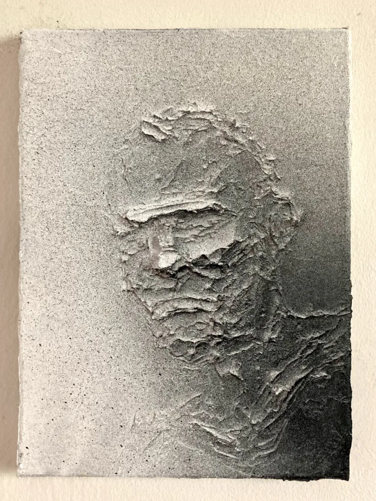 Tactile Relief Portrait Of A Male In Black And White — monochrome oil, wax and spray paint relief; a three-quarter male head in thick sculpted impasto under an even gray spray gradient