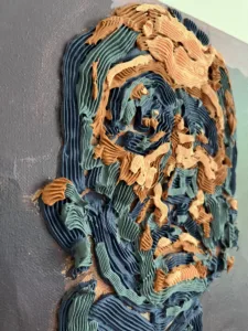 Tactile Squeeze Male Portrait Upward Gaze In Blue And Yellow — painting; in acrylic on canvas; gray and red tones — detail 2 of 4, close-up of surface texture