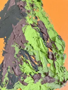 Tactile Textured Female Figure In Camouflage Colors On Orange Background — painting; built up in heavy, tactile impasto — detail 1 of 2, close-up of surface texture
