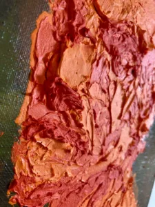 Tactile Textured Portrait Of A Man In Orange On Camouflage Background — painting; built up in heavy, tactile impasto — detail 3 of 4, close-up of surface texture
