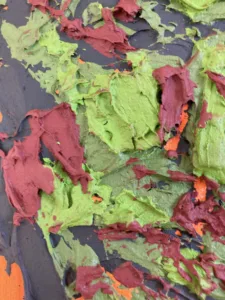 Tactile Textured Portrait Of Man In Camouflage Colors On Orange Background — painting; built up in heavy, tactile impasto — detail 2 of 4, close-up of surface texture
