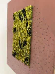 Tactile Textured Squeeze Mohawk — abstract oil-and-wax relief; a dense rectangle of yellow and black piped strands on a dotted rose-brown ground — detail 2 of 5, close-up of surface texture