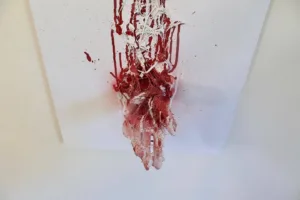 Youre Back — painted relief; of a single figure; built up in heavy, tactile impasto; in spray paint; red and white tones — detail 2 of 3, close-up of surface texture
